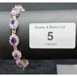 A silver cz and amethyst link bracelet