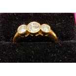 An 18ct yellow gold (tested) three stone gradated diamond ring of 1.35ct