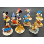 A Collection of 10 Royal Doulton Disney figures, Includes Gold stamped and limited editions.