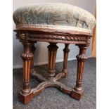 19th century Gothic revival stool [Holland & Sons] the circular cushioned seat above a carved