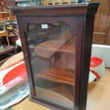 Mahogany wall corner cabinet .