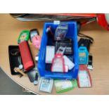 Box of mobile phones , trump cards , watches , sound bar etc.