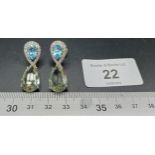 A pair of silver cz and pear shaped aquamarine earrings
