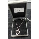 A 9ct white gold diamond set heart shaped pendant necklace