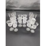 Six Edinburgh crystal thistle cut champagne flutes together with ten thistle cut wine glasses