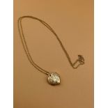 9ct gold locket with 9ct gold chain. [1.74grams] [Will post]