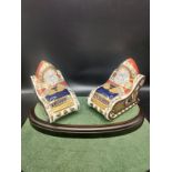 Pair of Royal crown Derby paperweights santa and sleigh figures with stoppers. 11 cm in length .