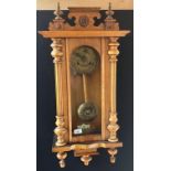 Antique light wood wall clock, Brass ornate face and pendulum. Marked 'B' To brass work. Double