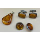 Silver and amber earrings, Silver and amber cuff links and 835 silver gilt and amber pendant. [