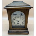 Antique oak cased bracket clock, Movement by Kienzle- German made, Comes with key and pendulum. [
