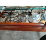 Large shelf of silver plated cutlery, tureen dishes etc