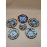 Japanese porcelain plates and bowl with hand painted and gilt butterfly design throughout,