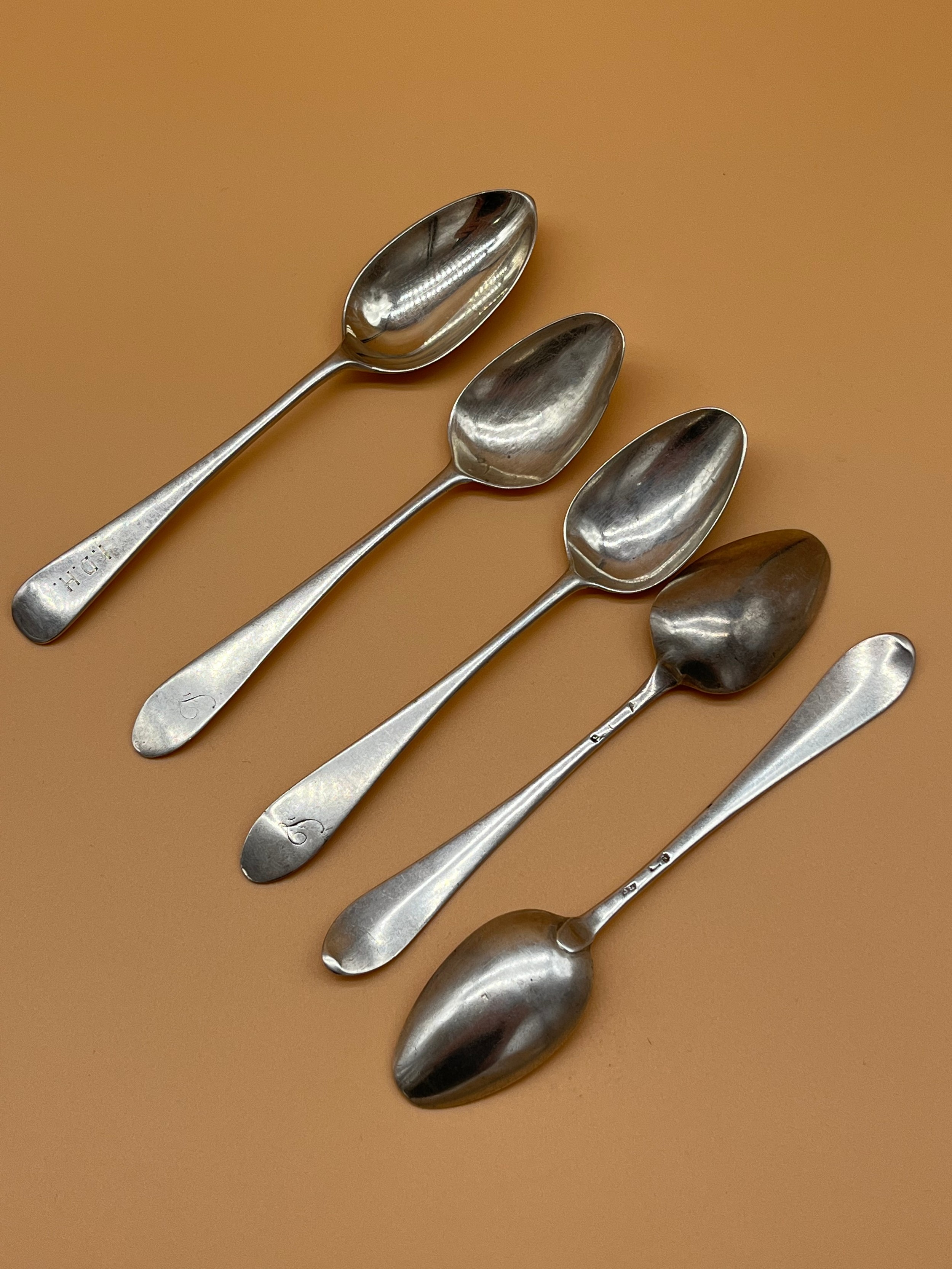 Four antique silver tea spoons together with London silver tea spoon. [72.89grams] [Will post]