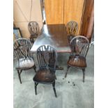 Ercol style table with Five-wheel back chairs.