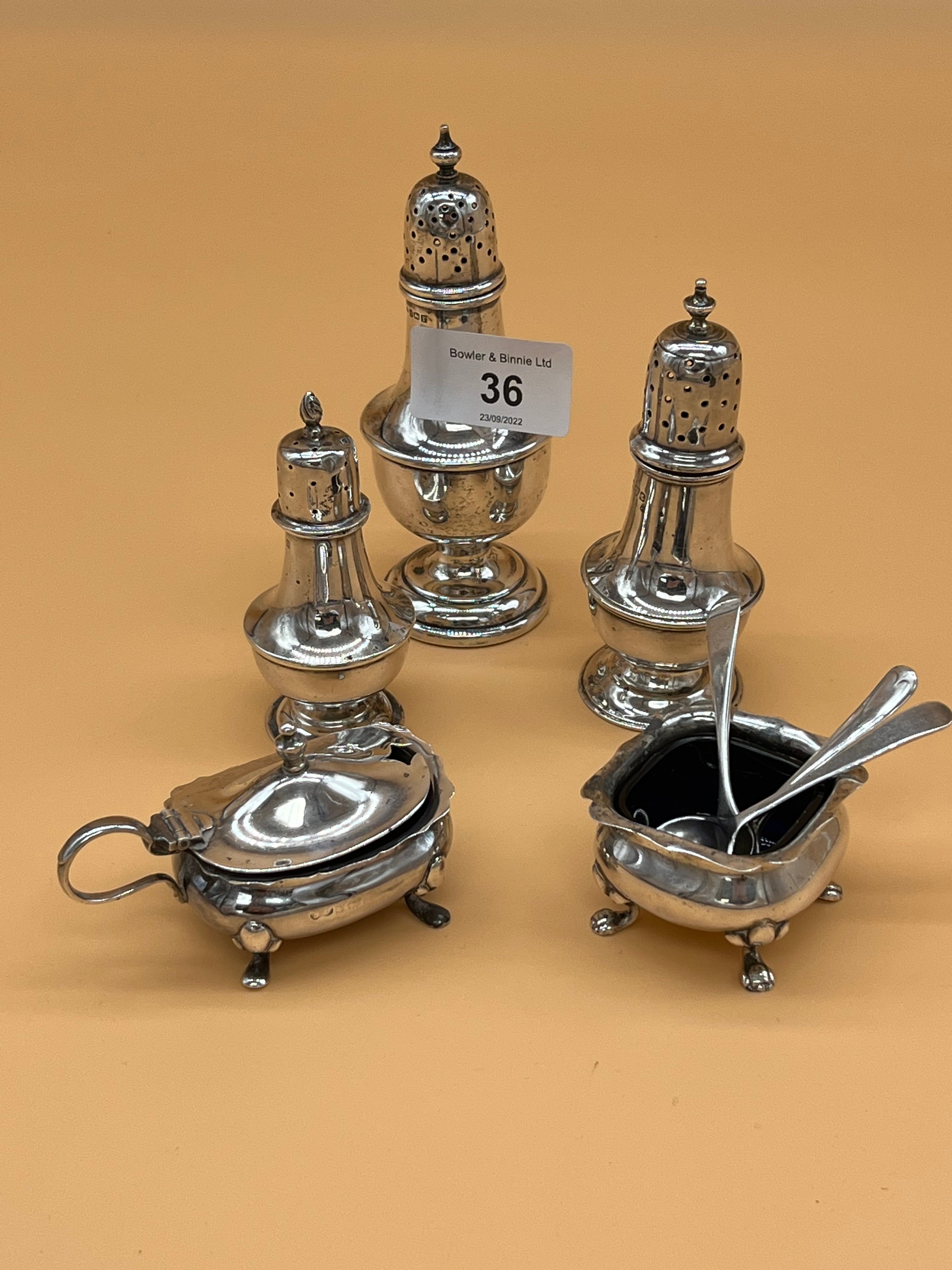 Collection of silver condiment items to include Three silver Birmingham and Chester pepper pots,