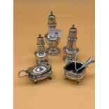 Collection of silver condiment items to include Three silver Birmingham and Chester pepper pots,