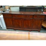 Large reproduction breakfront sideboard.