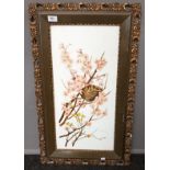 Antique painting on milk glass depicting birds nesting within a blossom tree. Ornate frame