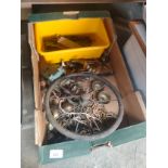 Box of miscellaneous fixtures and old wheel etc