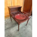 Reproduction telephone table with leather writing area.