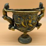 Antique gilt bronze two handle urn. Depicting to fawn figure handles, Various nude figures on sea