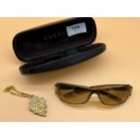 Gucci sunglasses, case and metal key chain.