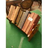 Antique style bookshelf together with collection of old books.