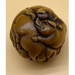 Japanese hand carved netsuke sculpture of a group of pigs huddled together, fitted with black bead