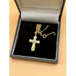 9ct gold cross pendant together with a 9ct gold necklace. Cross is fitted with five diamonds. [3.