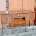 19th century serpentine front sideboard. Supported on square tapered legs.