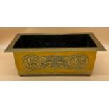 Arts and Crafts brass worked planter. detailed with Celtic panels. [Missing handle] [19x49x24cm]