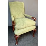George III style armchair, the cushioned back above open arm carved scroll supports and a