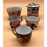 Five various antique Wemyss ware items. Includes Jazzy rose pattern cup, Cabbage rose cream and