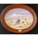 Oval framed watercolour depicting beach scene [38x48cm]