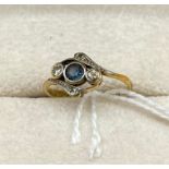 Ladies 18ct yellow gold ring set with a single sapphire stone off set by two diamonds to each