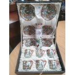 1900s Oriental ghiesha scene tea service in fitted case together with oriental vase .