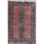 Antique rug in a salmon pink tone