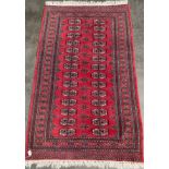 Indian/ Persian red ground rug. [158x96cm]