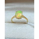 10ct yellow gold ring set with a large opalescent style stone. [2.14grams] [Ring size R]