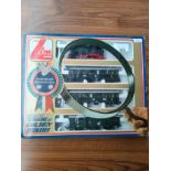 Boxed Lima 4 piece train loco and carriage set.