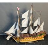 A Large hand built galleon ship fitted with sails and rigging. Comes with wooden stand. [91x103cm]