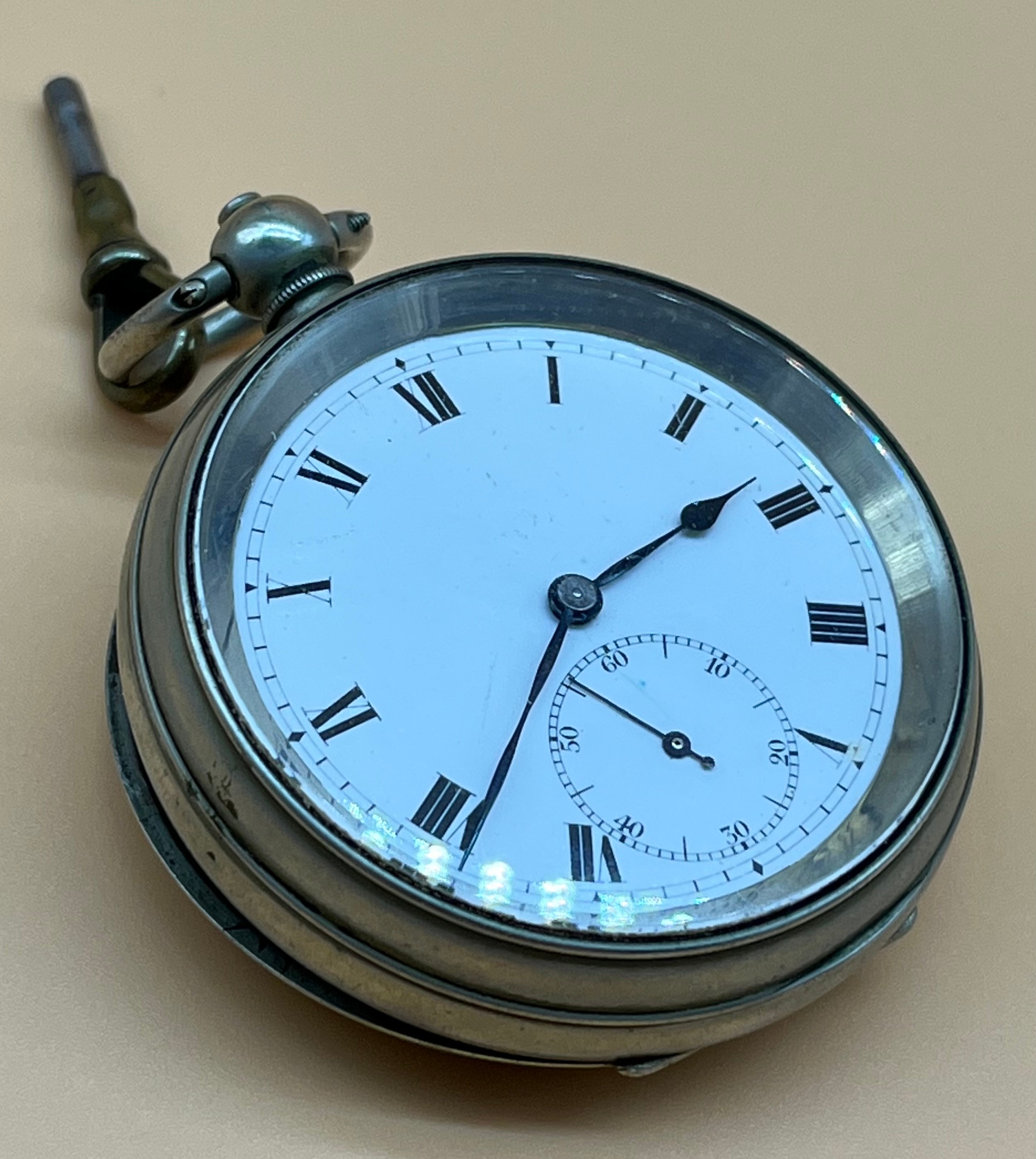 Antique pocket watch fitted within a nickel case, Enamel face. Swiss made New Magnetic. Comes with a