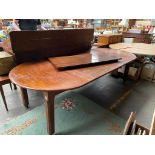 Large 19th century extendable dinning room table on casters .
