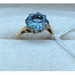 9ct yellow gold and aquamarine star cut stone ring. [Ring size J] [2.89grams]