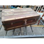 Antique travel trunk with wooden bounds