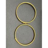 Two 9ct yellow gold bangles. [14.28grams] [6.5cm inner diameter] [Will Post]