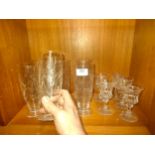 Collection of Edinburgh crystal thistle tall glasses together with other thistle pattern glasses .