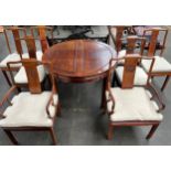 20th century Chinese Rosewood table, the circular top opening to extend with two additional