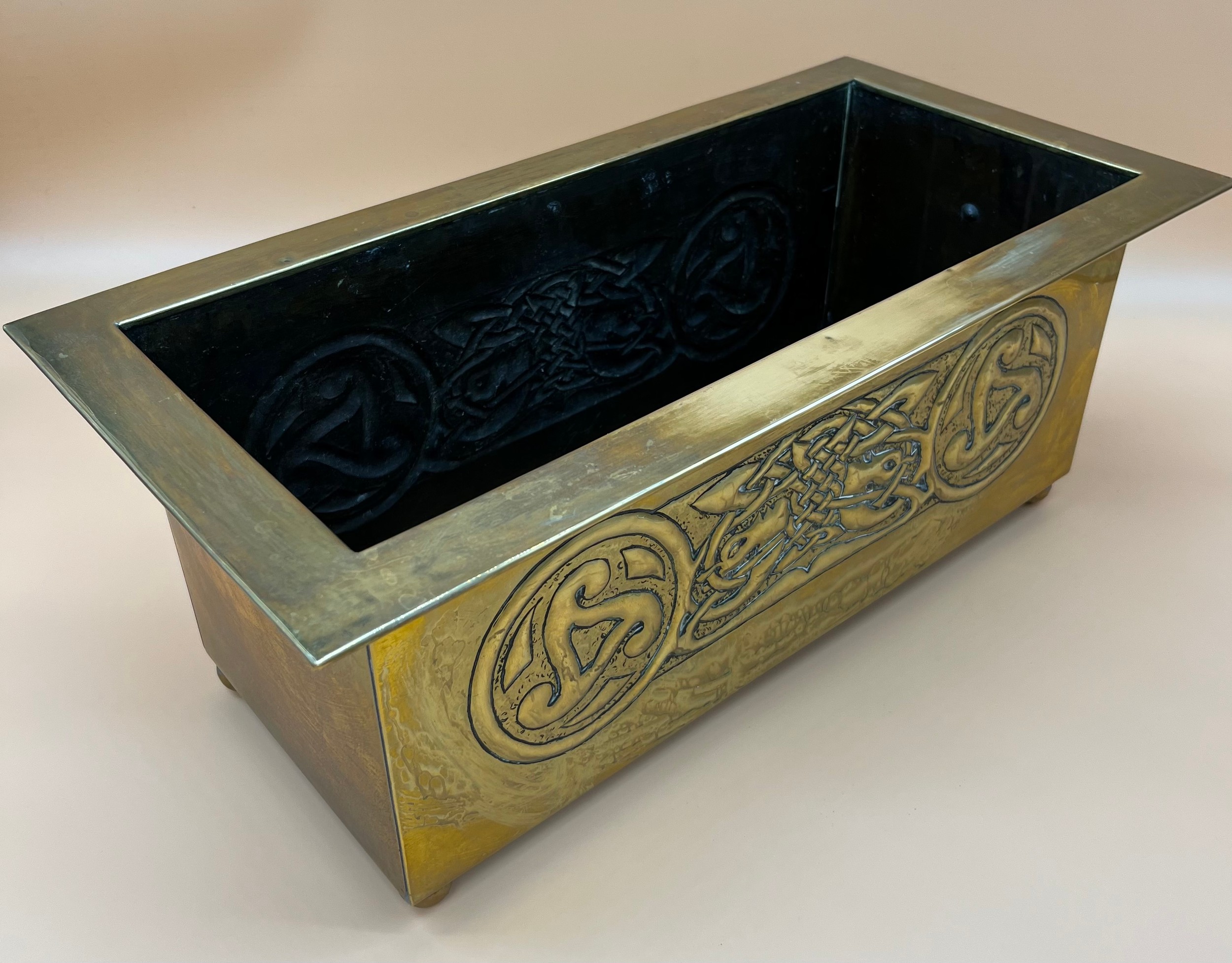 Arts and Crafts brass worked planter. detailed with Celtic panels. [Missing handle] [19x49x24cm] - Image 3 of 6