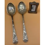 A Pair of 19th century highly detailed serving spoons detailed with birds and foliage. Together with